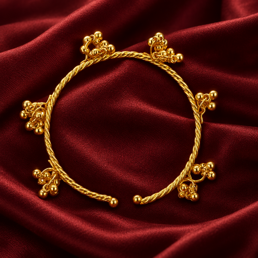 Adjustable gold ghungroo kada on deep maroon silk